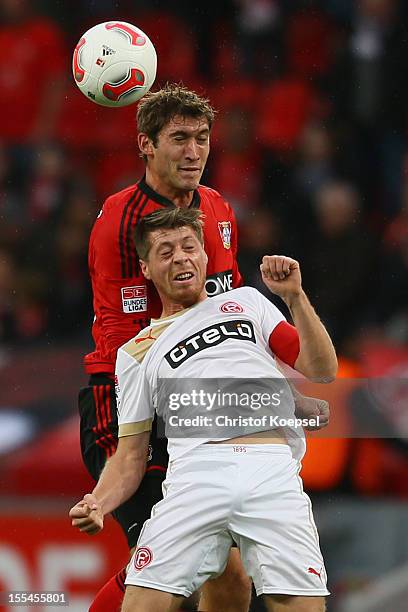 Stefan Reinartz of Leverkusen and Andreas Lambertz of Duesseldorf go up for a header during the Bundesliga match between Bayer 04 Leverkusen and...