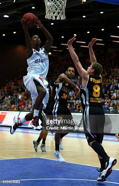 Stefan Jackson of Bremerhaven challenges for the ball with Lucca Satiger of Ludwigsburg during the Beko BBL basketball match between Eisbaeren...