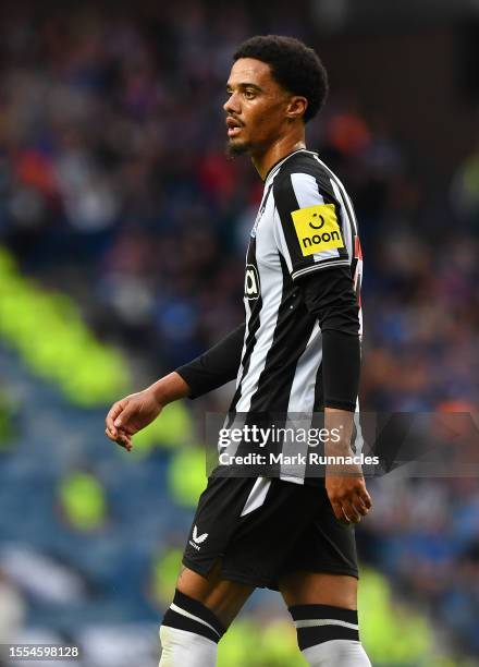 Jamal Lewis of Newcastle United in action during the pre-season friendly match between Rangers and Newcastle at Ibrox Stadium on July 18, 2023 in...