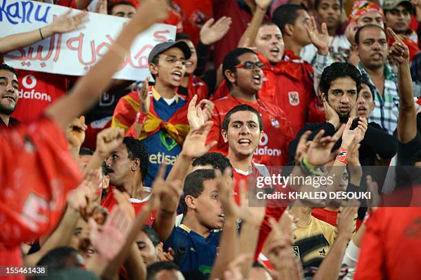 Egypt's Al-Ahly fans cheer before their football match against Tunisian team, Esperance de Tunis, during their CAF Confederation Cup final first leg...