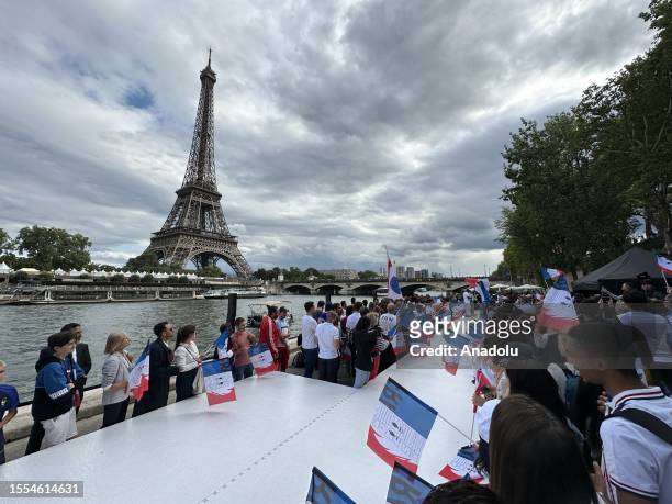 Pre-Olympic tour along the Seine with the Eiffel Tower in the background on July 25, 2023 in Paris, France. On July 26 for the first time in the...