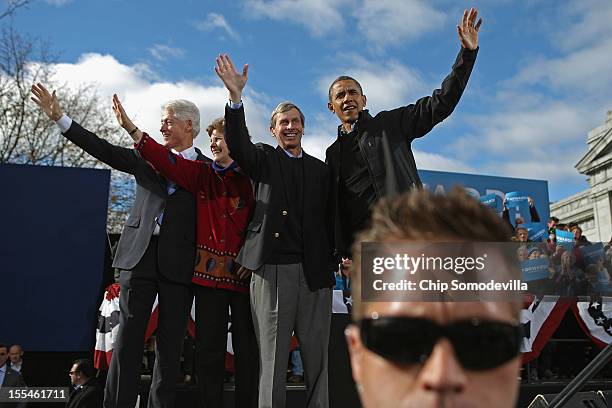 Former President Bill Clinton, Sen. Jeanne Shaheen , New Hampshire Gov. John Lynch and U.S. President Barack Obama wave to supporters at the end of a...