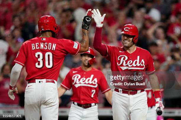 Will Benson and Curt Casali of the Cincinnati Reds celebrate after Benson hit a home run in the second inning against the San Francisco Giants at...
