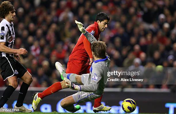 Luis Suarez of Liverpool scores his team's first goal past Tim Krul of Newcastle United during the Barclays Premier League match between Liverpool...