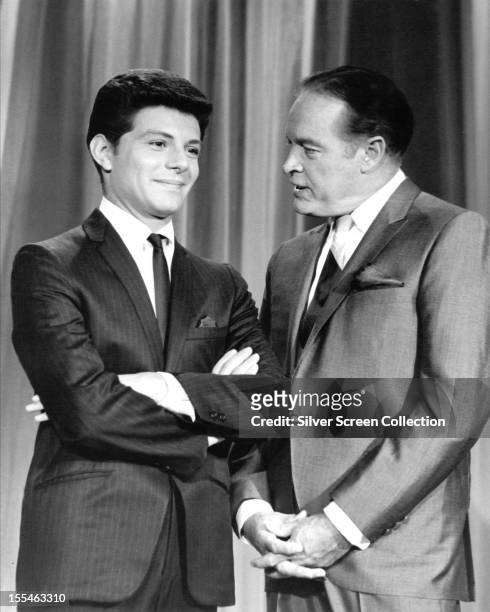 American comedian Bob Hope with his guest vocalist, American singer Frankie Avalon, on 'The Bob Hope Show', circa 1965.