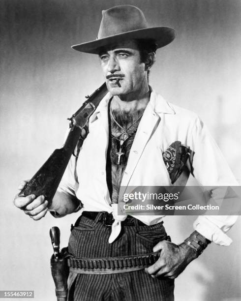 Mexican-born American actor Gilbert Roland as he appears in 'Bandido', directed by Richard Fleischer, 1956. Roland plays Colonel Escobar in the film.