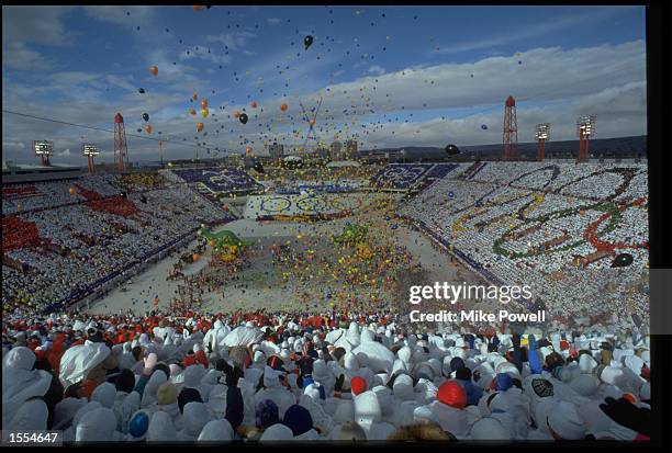 THE COLOURFUL CROWD LOOKS ON AS HUNDREDS OF BALLOONS ARE RELEASED DURING THE OPENING CEREMONY OF THE 1988 WINTER OLYMPICS IN CALGARY.