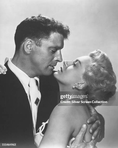 American actor Burt Lancaster as First Sergeant Milton Warden, and Scottish actress Deborah Kerr as Karen Holmes, in 'From Here To Eternity',...