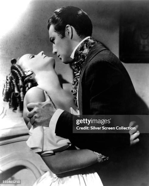 Swedish actress Greta Garbo as Marguerite Gautier, and American actor Robert Taylor as Armand Duval, in 'Camille', directed by George Cukor, 1936.