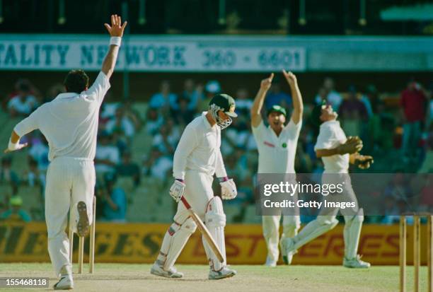 South African bowler Fanie de Villiers celebrates taking the wicket of Mark Taylor during Australia's second innings during the 2nd Test against at...