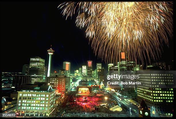 FIREWORKS EXPLODE ABOVE THE SKYLINE OF CALGARY DURING THE OPENING CEREMONY FOR THE 1988 WINTER OLYMPICS HELD IN CALGARY IN CANADA.