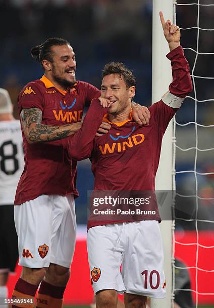 Francesco Totti with his teammate Pablo Daniel Osvaldo of AS Roma celebrates after scoring the opening goal during the Serie A match between AS Roma...