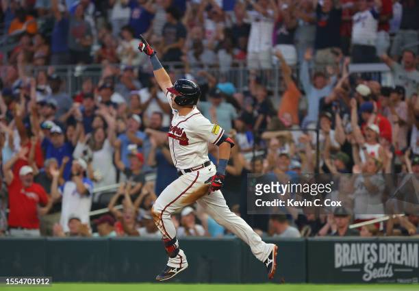 Austin Riley of the Atlanta Braves reacts as he rounds first base after hitting a three-run homer in the fourth inning against the Arizona...
