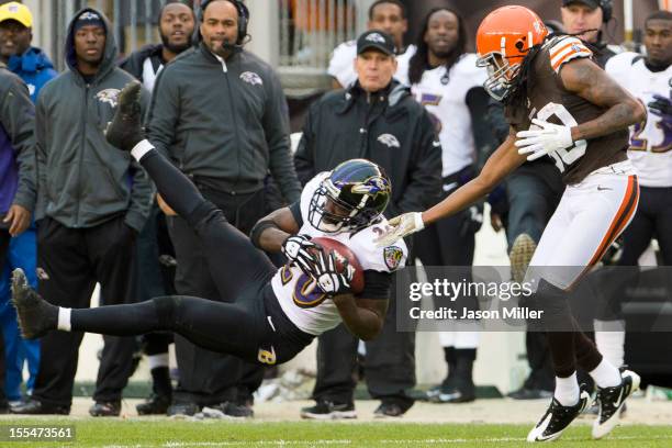 Free safety Ed Reed of the Baltimore Ravens catches an interception intended for wide receiver Travis Benjamin of the Cleveland Browns during the...