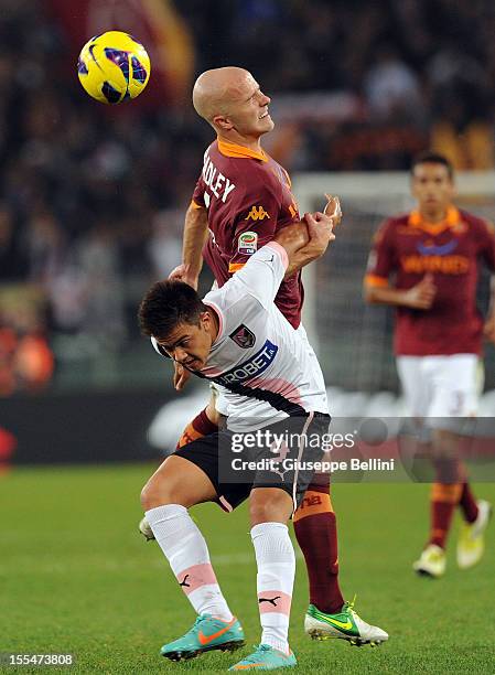 Michael Bradley of Roma and Paulo Dybala of Palermo in action during the Serie A match between AS Roma and US Citta di Palermo at Stadio Olimpico on...