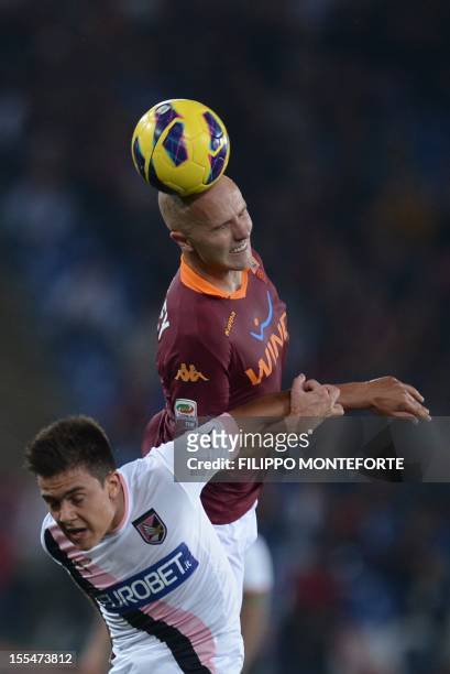 Roma's US midfielder Michael Bradley fights for the ball with Palermo's Argentinian forward Paulo Dybala on November 4, 2012 during a Serie A...