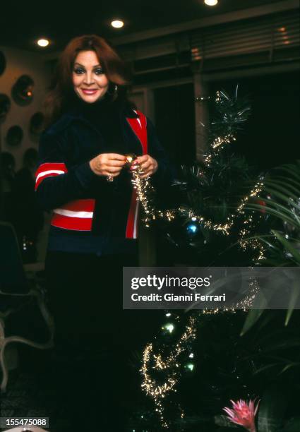 The Spanish actress Sara Montiel with Christmas Tree Madrid, Castilla La Mancha, Spain. .