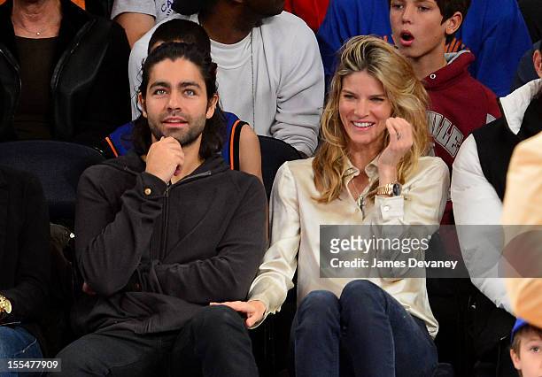 Adrian Grenier and Le Call attend the Philadelphia 76ers vs New York Knicks game at Madison Square Garden on November 4, 2012 in New York City.