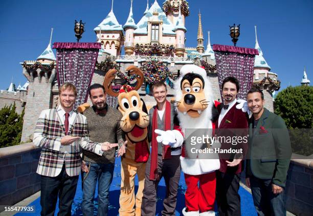 In this handout photo provided by Disney Parks, Brian Littrell, AJ McLean, Nick Carter, Kevin Richardson and Howie Dorough of the Backstreet Boys...