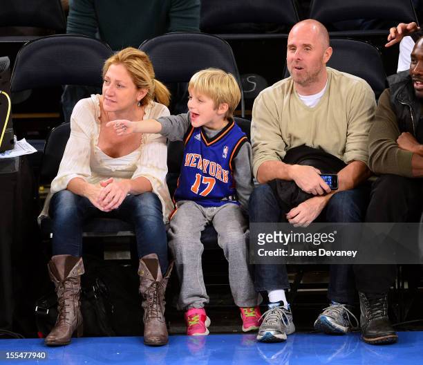 Edie Falco, Anderson Falco and Paul Schulze attend the Philadelphia 76ers vs New York Knicks game at Madison Square Garden on November 4, 2012 in New...