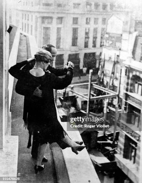 Couple dancing charleston on the terrace of a house in Regent Street, London .