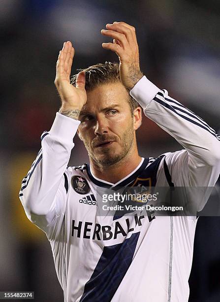 David Beckham of the Los Angeles Galaxy applauds the fans after their MLS playoff match against the Vancouver Whitecaps at The Home Depot Center on...