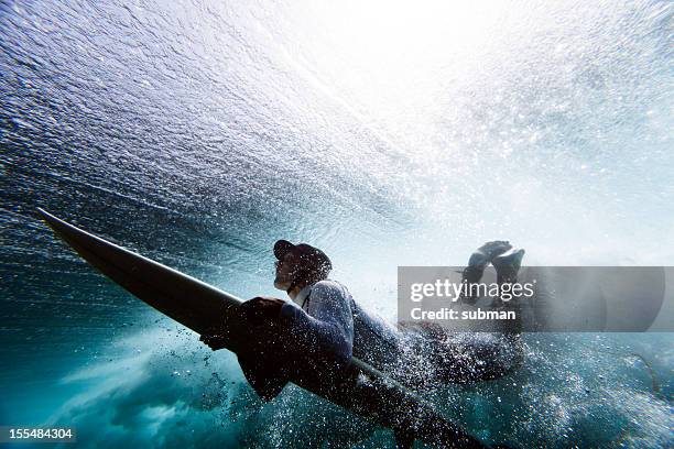 surfer duck diving - duck dive stock pictures, royalty-free photos & images