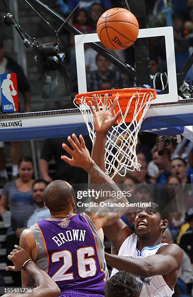 Orlando Magic rookie Andrew Nicholson guards Phoenix Suns' Shannon Brown on Sunday, November 4 in Orlando, Florida. The Magic won the game 115-94.