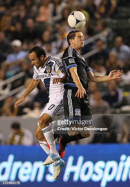 Sam Cronin of the San Jose Earthquakes and Landon Donovan of the Los Angeles Galaxy vie for the high ball in the first half during the first leg of...