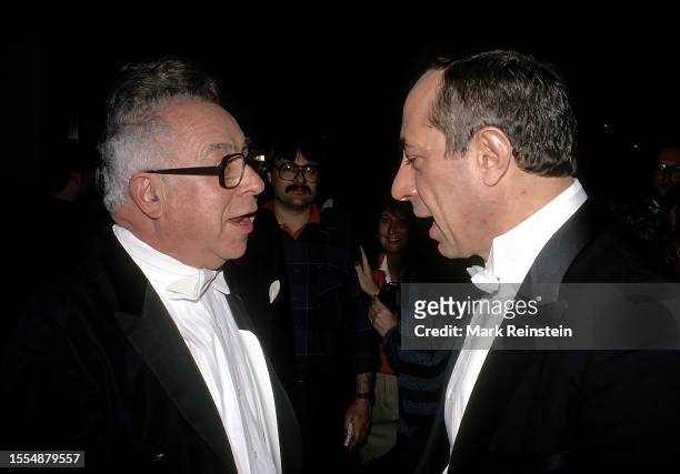 Art Buchwald and New York Governor Mario Cuomo stop to chat as they attend the White Tie Gridiron Club dinner at the Capitol Hilton Hotel Washington...