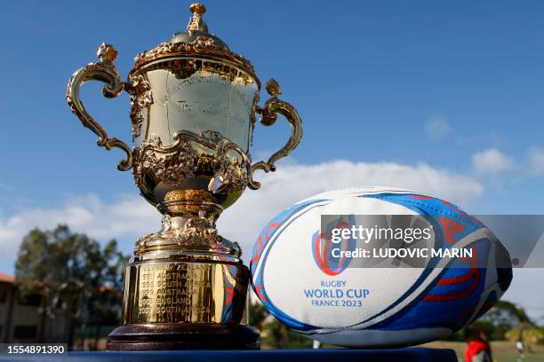 The Webb Ellis Cup trophy and the Gilbert Rugby World Cup 2023 Rugby ball are pictured ahead of French President Emmanuel Macron's visit to the...