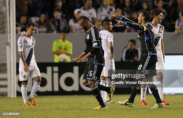 Victor Bernardez and Chris Wondolowski of the San Jose Earthquakes celebrate Bernardez's 90th minute goal as Juninho, Sean Franklin and Omar Gonzalez...