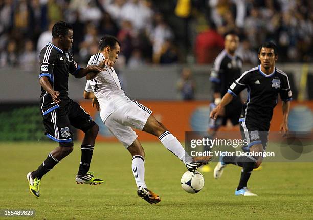 Juninho of the Los Angeles Galaxy and Marvin Chavez of the San Jose Earthquakes vie for the ball in the first half during the first leg of the MLS...