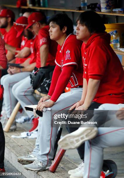 Shohei Ohtani of the Los Angeles Angels watches from the dugout during the second inning of a game against the Detroit Tigers at Comerica Park on...