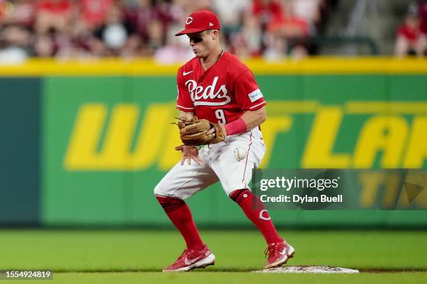 Matt McLain of the Cincinnati Reds misplays a throw at second base in the sixth inning against the San Francisco Giants at Great American Ball Park...