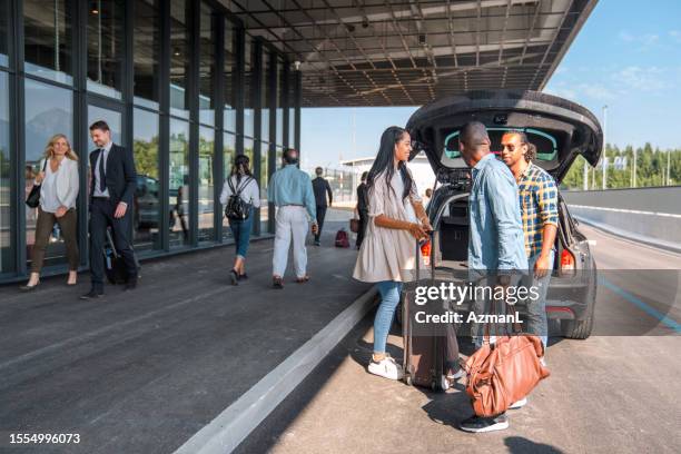 friends saying goodbyes at the airport - indian arrival stock pictures, royalty-free photos & images