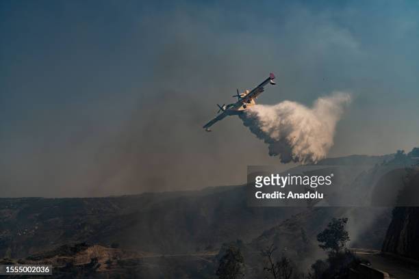 Aerial firefighting continues as teams conduct extinguishing works by land and air to control wildfires across in Reggio Calabria, Italy on July 25,...
