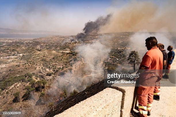 Smoke rises as teams try to extinguish wildfires in Mosorrofa, Reggio Calabria, Italy on July 25, 2023.