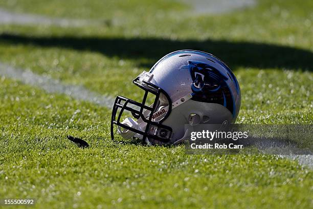 Carolina Panthers helmet sits on the grass as the team warms up before the start of their game against the Washington Redskins at FedExField on...