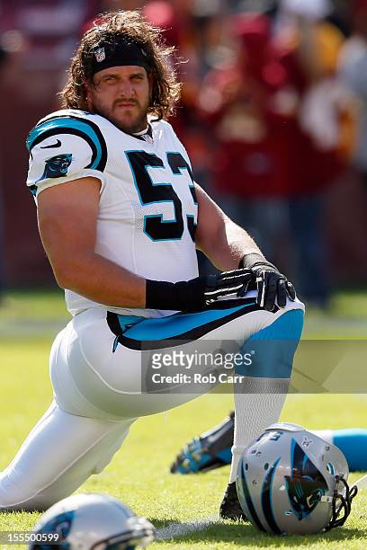 Linebacker Jason Phillips of the Carolina Panthers stretches before the start of the Panthers game against the Washington Redskins at FedExField on...
