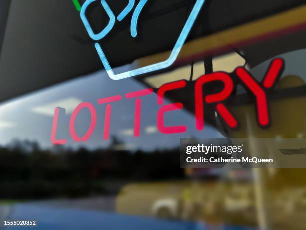 lottery mania: illuminated lottery sign - lotterie stock-fotos und bilder