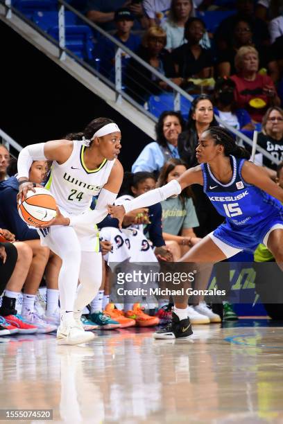 Arike Ogunbowale of the Dallas Wings looks to pass the ball during the game against the Connecticut Sun on July 25, 2023 at the College Park Center...