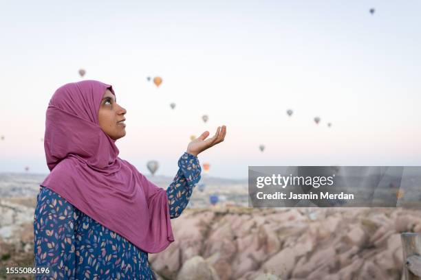 muslim woman at cappadocia, turkey - veil isolated stock pictures, royalty-free photos & images