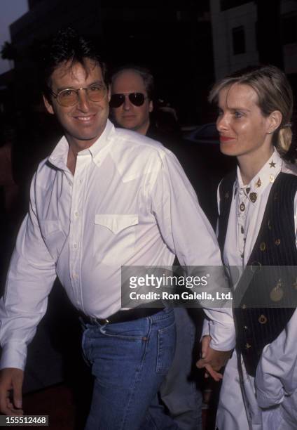 Actor Robert Carradine and wife Edie Mani attending the premiere of Sketch Artist on June 1, 1992 at The Academy Theater in Beverly Hills, California.