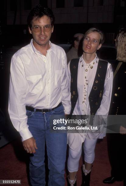 Actor Robert Carradine and wife Edie Mani attending the premiere of Sketch Artist on June 1, 1992 at The Academy Theater in Beverly Hills, California.