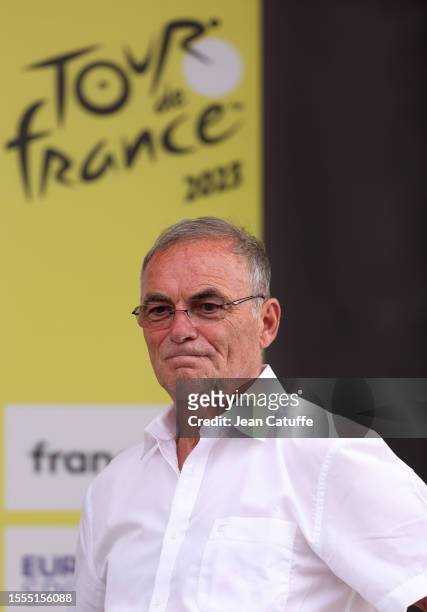 Bernard Hinault looks on during the podium ceremony of stage sixteen of the 110th Tour de France 2023, a 22.4km individual time trial ITT stage from...