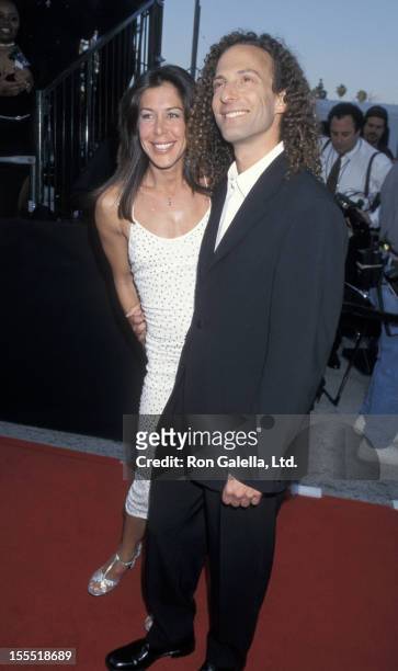 Musician Kenny G and Lyndie Benson attend Arista Record 25 Years of Number 1 Hits Celebration on April 10, 2000 at the Shrine Auditorium in Los...