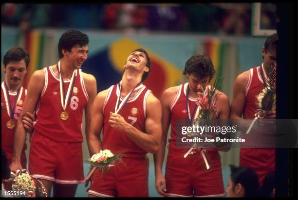 THE BASKETBALL TEAM REPRESENTING THE SOVIET UNION CELEBRATE AFTER RECEIVING THEIR GOLD MEDALS AFTER WINNING THE BASKETBALL TOURNAMENT AT THE 1988...