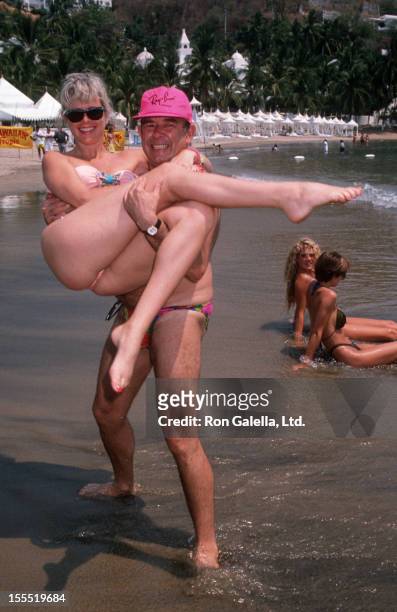 Television Personality Robin Leach and wife Judith Ledford attend Las Hadas Celebrity Sports Invitational on May 11, 1990 at Las Hadas Resort in...