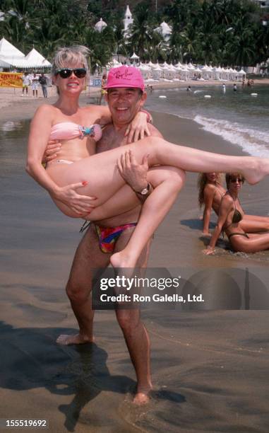 Television Personality Robin Leach and wife Judith Ledford attend Las Hadas Celebrity Sports Invitational on May 11, 1990 at Las Hadas Resort in...